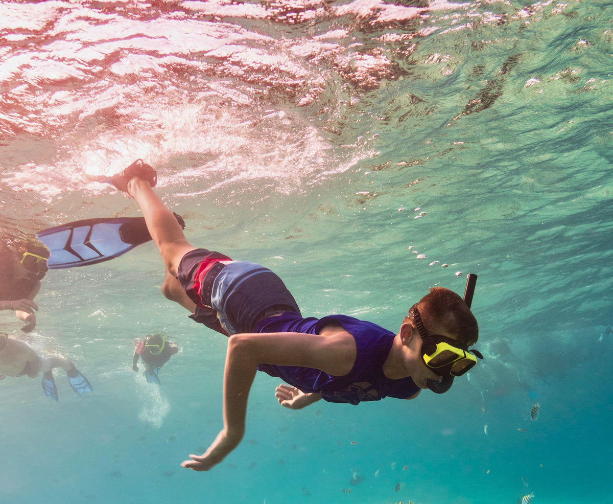Child snorkeling in the ocean